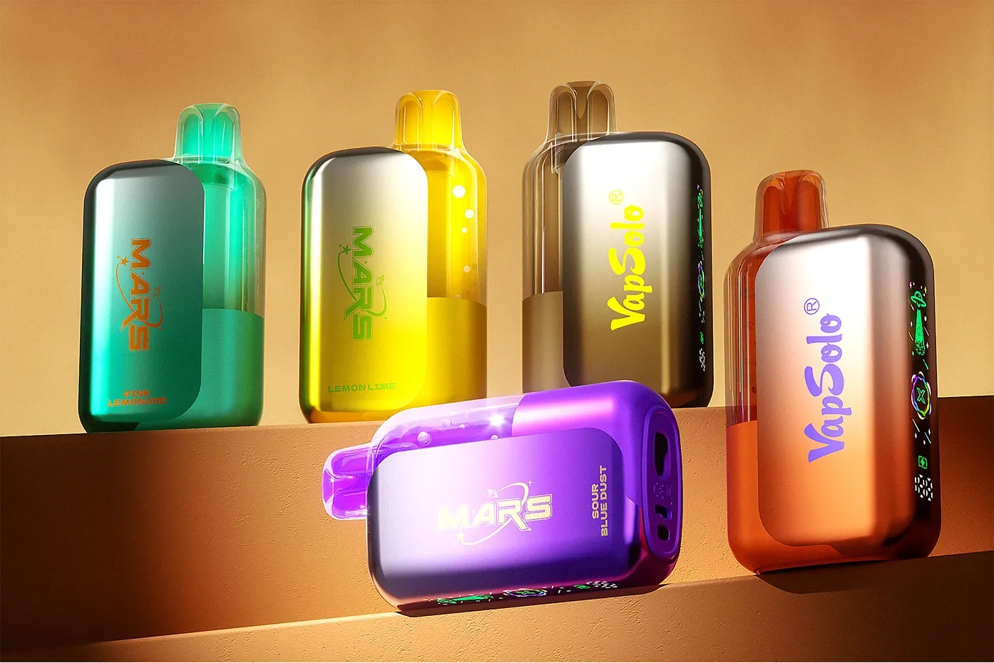 An assortment of Mars and VapSolo vapes displayed on a shelf. The Mars vapes feature Pink Lemonade and Lemon Lime flavors, while VapSolo vapes are shown in gold with bold branding.
