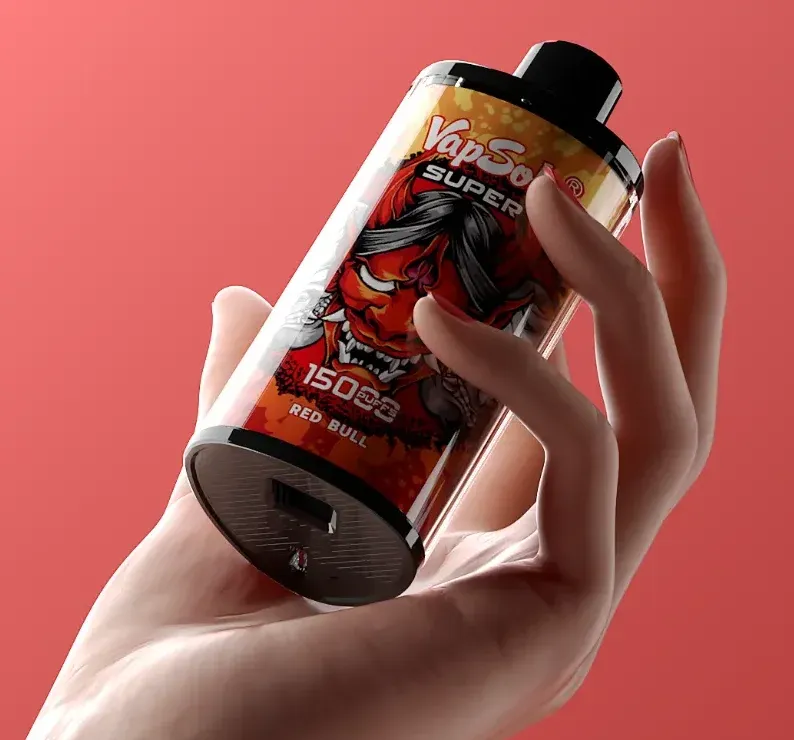 Close-up of a hand holding a VapSolo SUPER vape device, featuring 15000 puffs and Red Bull flavor, with a striking red demon graphic on a red background.